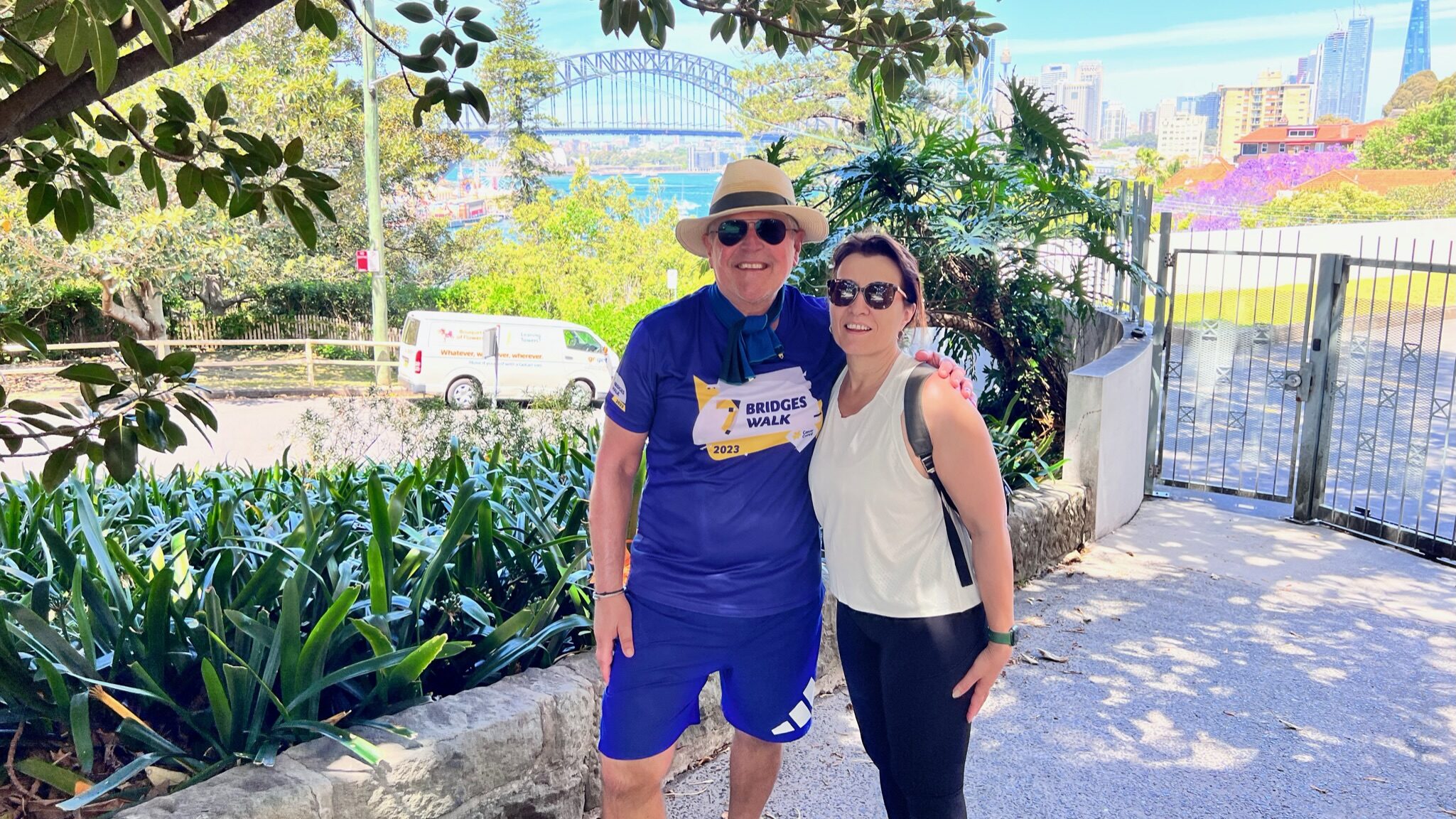 Les Hercules and Marie posing in front of the Sydney Harbour Bridge, during 7 Bridges Walk.