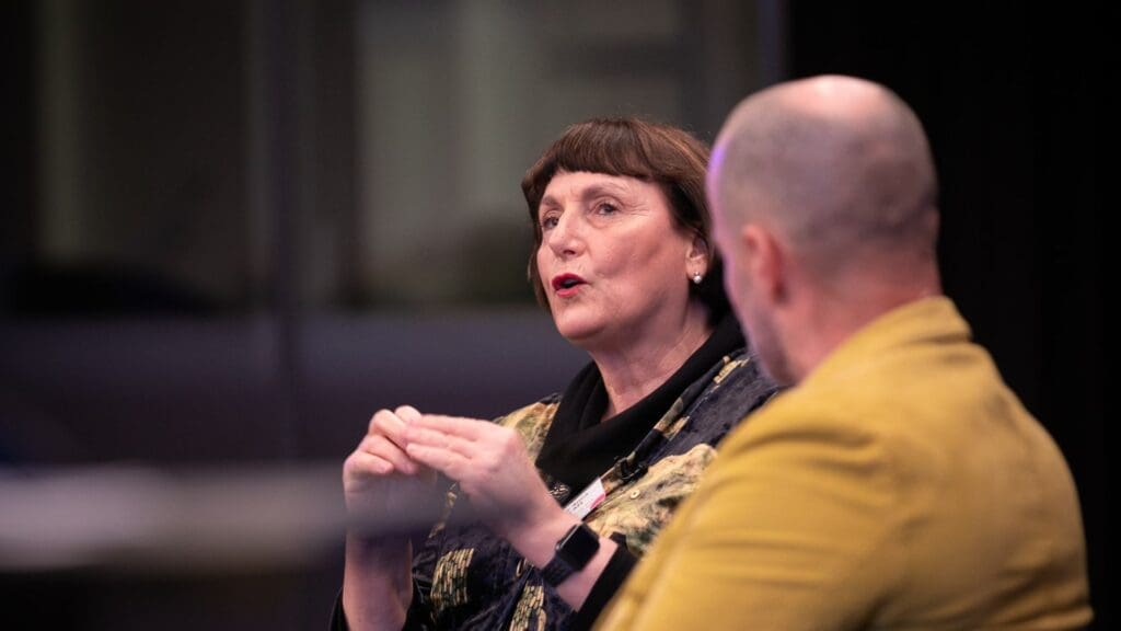 Professor Anna DeFazio talking to Adam Spencer at the Research Awards 2024.